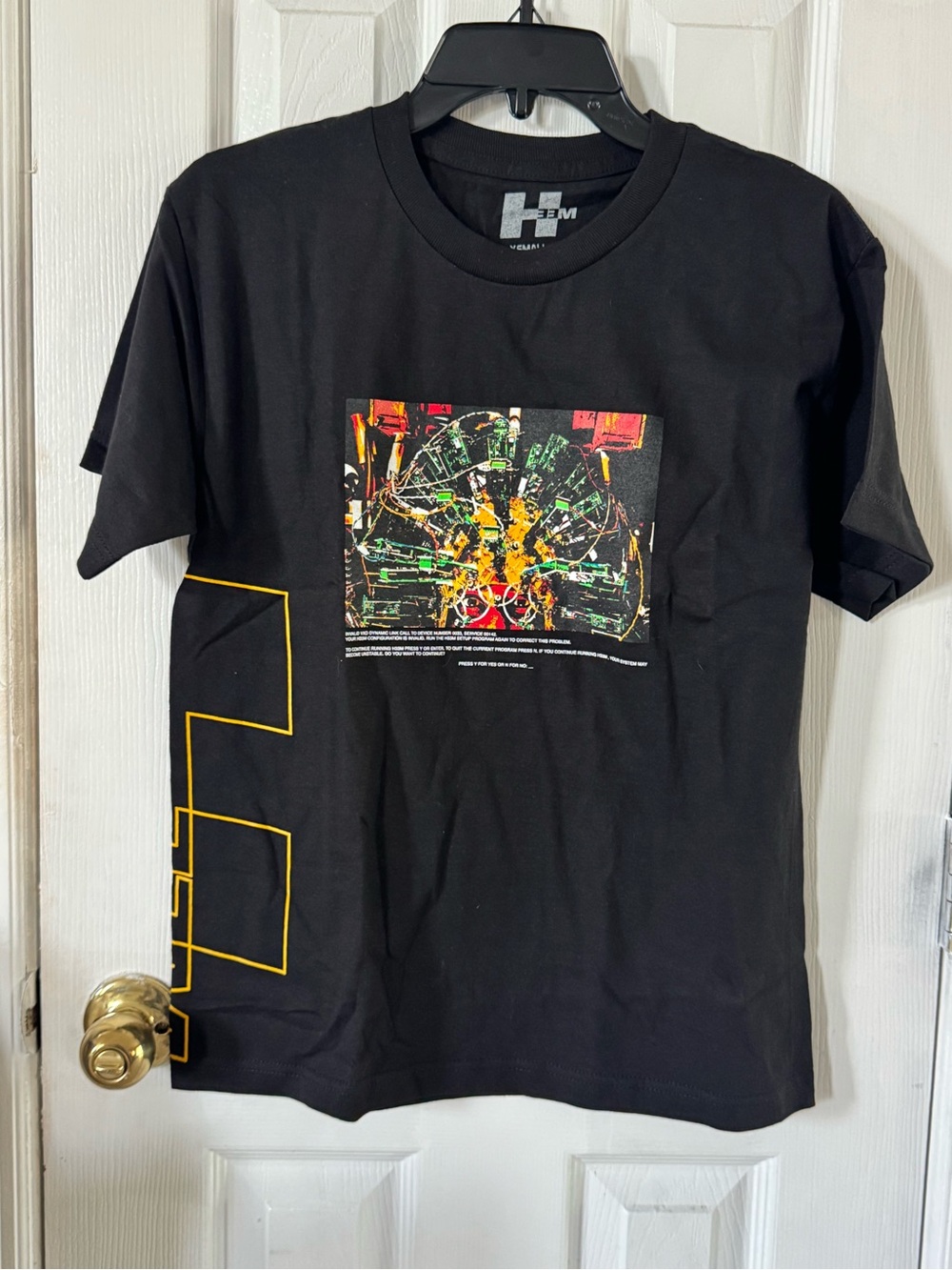 Hem Black Short Sleeve Graphic Tee with Yellow Accents
